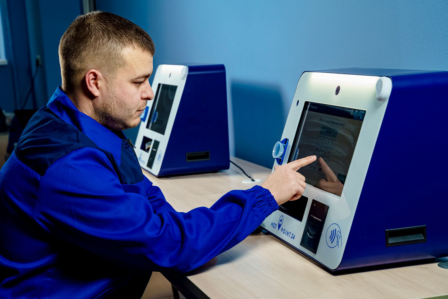Person using a clinic kiosk touchscreen